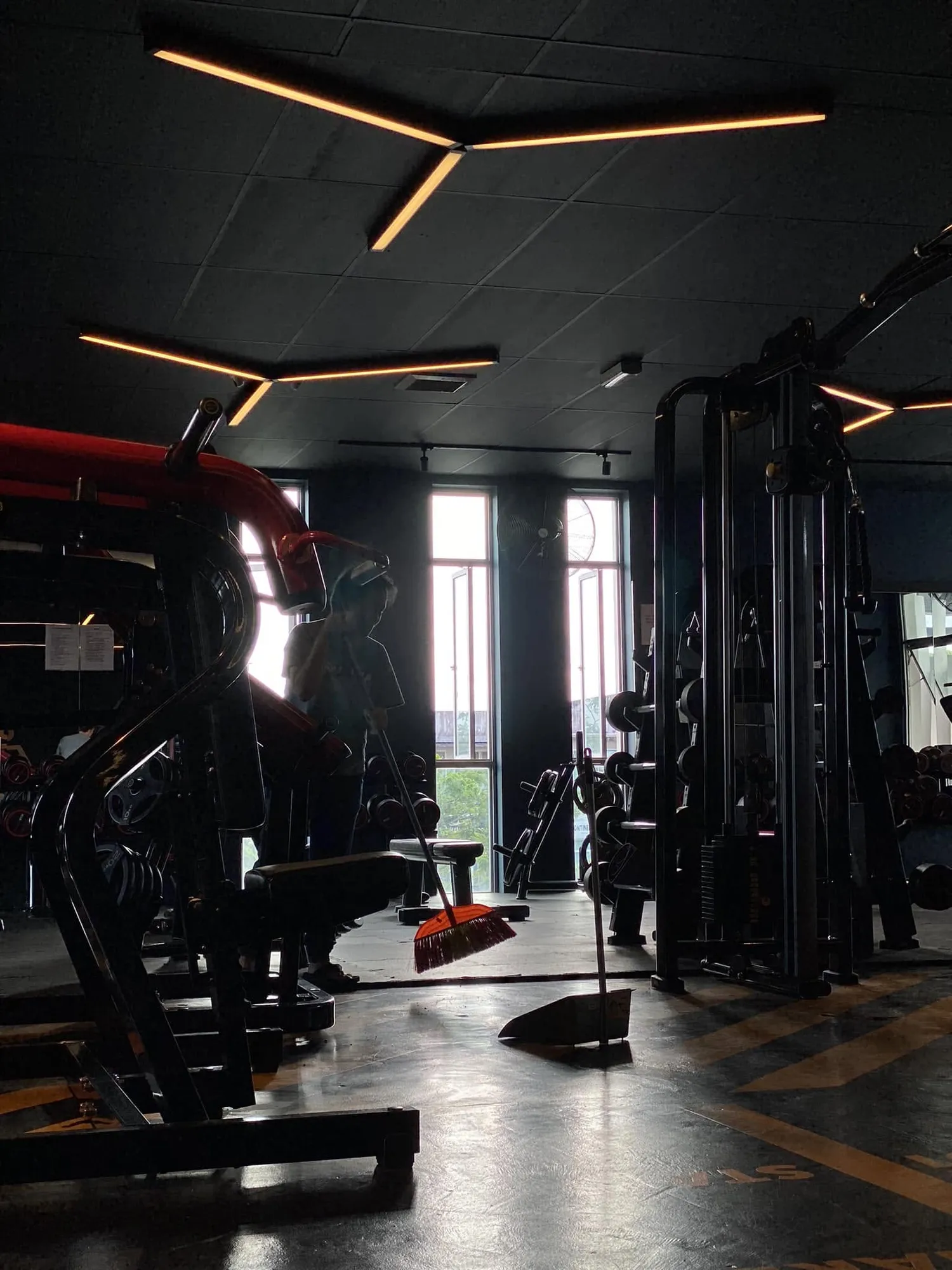 The gym floor early, lit mostly by the windows